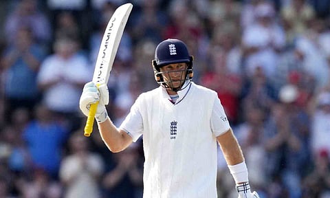 England's Joe Root celebrates after completing 150 runs on day three of the fourth test cricket match between India and England, at the Old Trafford Cricket Ground, in Manchester (PTI)