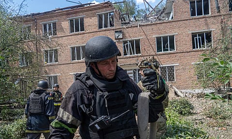 Rescuers work at a damaged city hospital that was hit by a Russian guided air bomb in Kharkiv, Ukraine (AP) 
