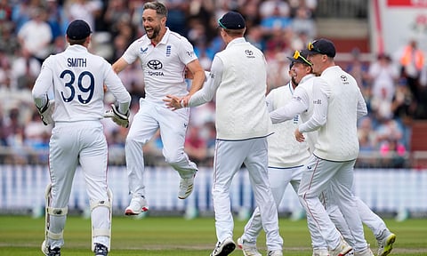 England's bowler Chris Woakes celebrates with teammates after the wicket of India's batter Sai Sudharsan during the fourth day of the fourth Test match between India and England, at the Old Trafford cricket ground, in Manchester, England, Saturday, July 26, 2025 (PTI) 