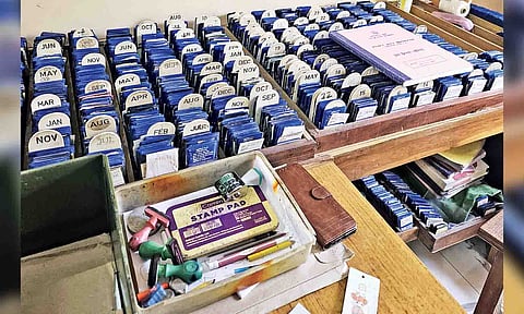 Log books and stamp pads in a public library that are used to track books yet to be returned by members