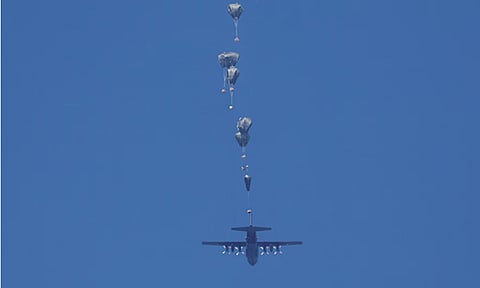 A plane airdrops humanitarian aid over Rafah in southern Gaza Strip (File Photo/Reuters)