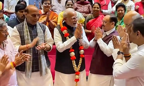 Prime Minister Narendra Modi being felicitated during the National Democratic Alliance (NDA) parliamentary party meeting, in New Delhi (PTI)