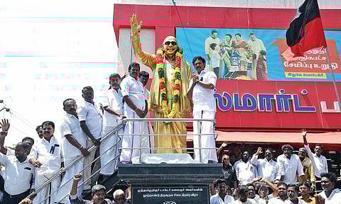 Education Minister Anbil Mahesh Poyyamozhi garlanding statue of late CM M Karunanidhi in Tiruchy on Thursday 