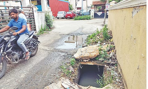 Uncovered drain poses danger on a street at Dhanalakshmi Nagar