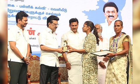 Chief Minister MK Stalin honouring a student from state board education for landing a prestigious job on Friday 