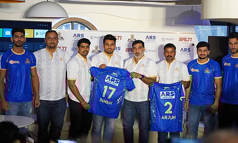 Head coach Sanjeev Baliyan, asst coach Suresh Kumar and players unveil the team jersey 
