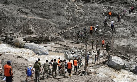Flash floods triggered by heavy rains killed at least 56 people in northwestern Pakistan and elsewhere in the country over the past 24 hours, as rescuers evacuated 1,300 stranded tourists from a mountainous district hit by landslides (AP)