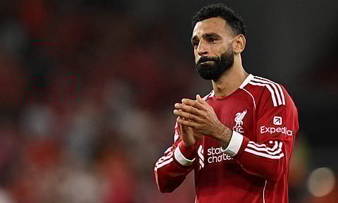 An emotional Mohamed Salah celebrates with fans after final whistle 