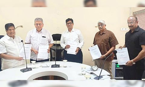 State Planning Commission member Ezhilan Naganathan submitting the report to the committee on Centre–State relations