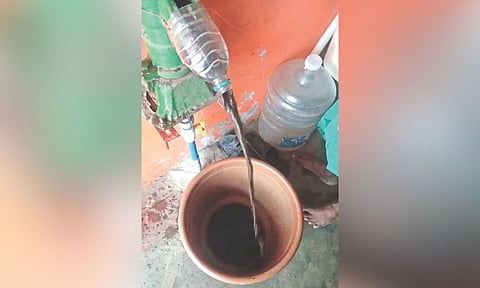 Black water that flows out of a pipe inside a home at Ezhil Nagar, Kodungaiyur