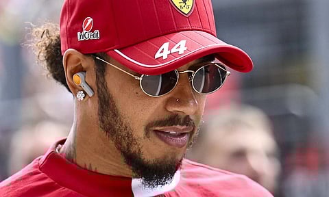 Ferrari driver Lewis Hamilton of the United Kingdom arrives to the drivers parade at the Hungaroring racetrack, in Mogyorod, Hungary, Sunday, Aug. 3, 2025, ahead of the Hungarian Formula One Grand Prix (AP) 