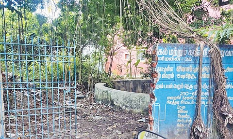 Metro Water Board land with a broken gate and unpruned trees on Muthamil Nagar 4th Street