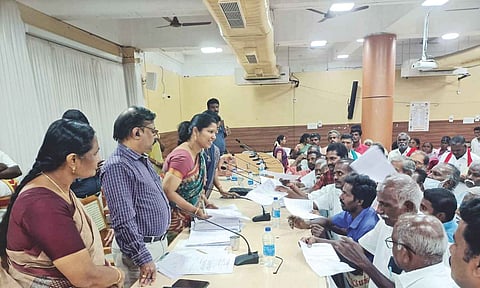 Farmers submit petitions to DRO Rajalakshmi during a redressal meeting in Tiruchy on Friday