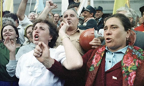 Ukrainian people celebrate in front of the parliament the day when Ukraine's independence was declared in Kyiv (AP)