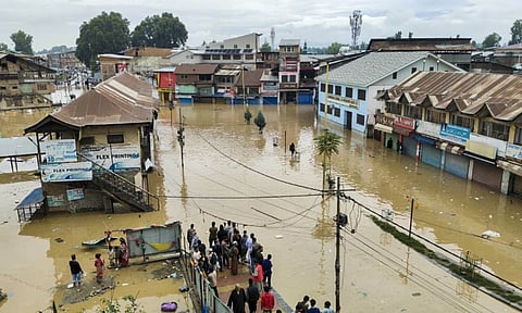 People stranded in a waterlogged area following heavy rainfall, in Anantnag, Wednesday, Aug. 27, 2025 (PTI) 