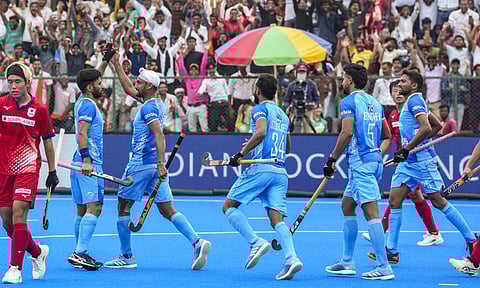 India's Mandeep Singh, 11, celebrates with teammates after scoring a goal during a Men's Hockey Asia Cup 2025 match between India and Japan, in Rajgir, Bihar, Sunday, Aug. 31, 2025 (PTI) 