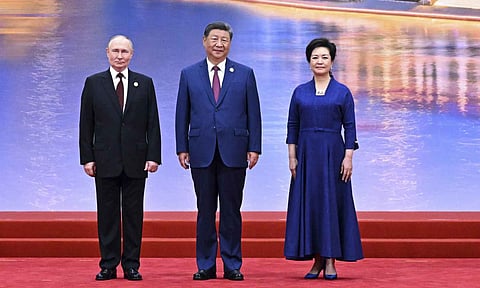 Russian President Vladimir Putin, left, Chinese President Xi Jinping, center, and his wife Peng Liyuan pose for a photo at a ceremony to welcome Heads of States of the Shanghai Cooperation Organization (SCO) summit in Tianjin, China , on Sunday, Aug. 31, 2025 (AP) 