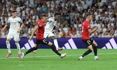 Vinicius Junior takes a shot to score Madrid's winner 