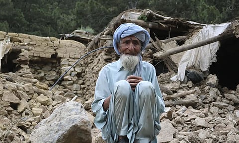 An Afghan man sits near his house that was destroyed in an earthquake in the Spera District of the southwestern part of Khost Province, Afghanistan, Wednesday, June 22, 2022 (AP)