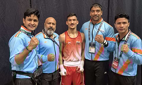Pawan Bartwal and his coaches after the bout 