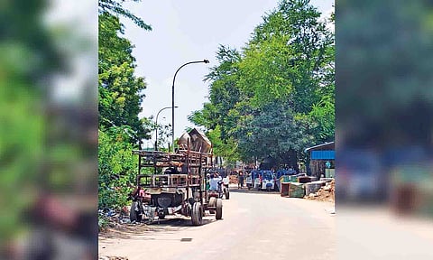 Rusting heavy construction machinery abandoned along Muthukumarappa Street for over a year 