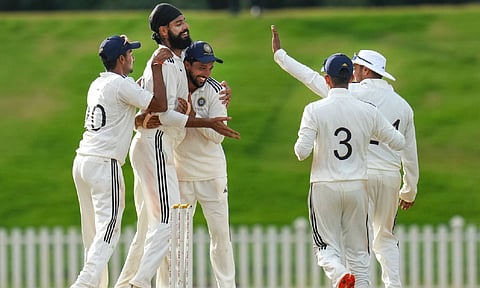South Zone's Gurjapneet Singh celebrates with teammates after taking the wicket of North Zone's Nishant Sindhu. (PTI)