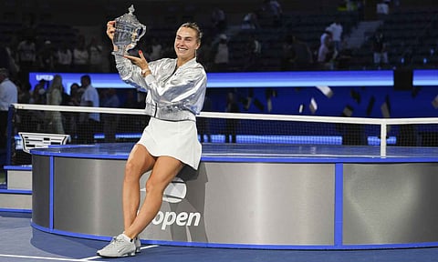 Aryna Sabalenka, of Belarus, holds up the championship trophy after defeating Amanda Anisimova, of the United States, in the women's singles final of the U.S. Open tennis championships, Saturday, Sept. 6, 2025, in New York (PTI) 