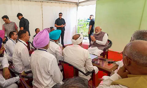 Prime Minister Narendra Modi interacts with flood-affected people, in Gurdaspur, Punjab.