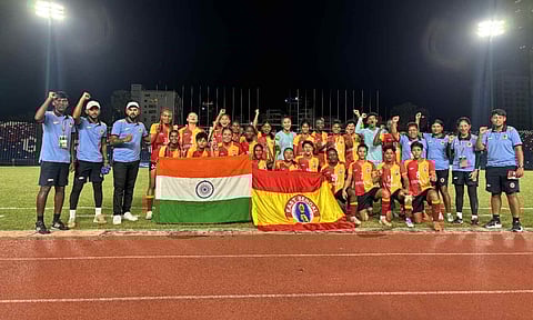 East Bengal team poses with national flag after qualifying for the league 