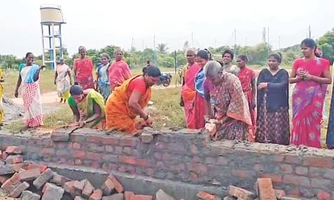 Women dismantling an under-progress structure in protest at the Ponthur village on Sunday