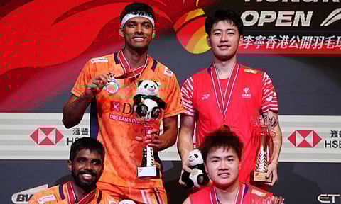 Satwiksairaj Rankireddy and Chirag Shetty with runner-up trophy 