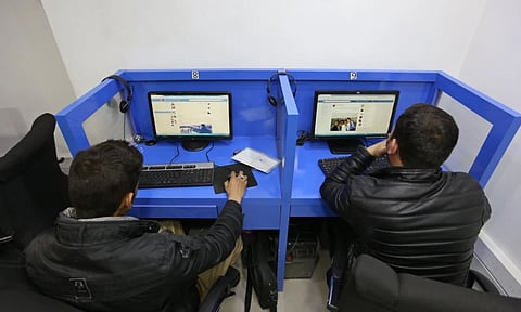 In this Feb. 10, 2016 photo, Afghanis access social media websites at a private internet cafe in Kabul, Afghanistan (AP)