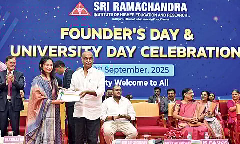 Chancellor VR Venkataachalam presenting Dr V Sanjana with three gold medals for her academic performance