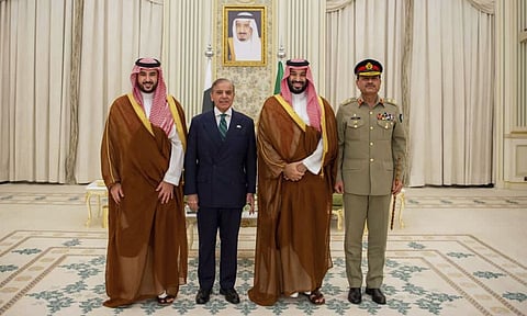This handout photograph released by the state-run Saudi Press Agency shows Pakistani Prime Minister Shehbaz Sharif, left, embracing Saudi Arabia's Crown Prince Mohammed bin Salman after signing a joint defense pact in Riyadh, Saudi Arabia, Wednesday, Sept. 17, 2025. (AP/PTI) 