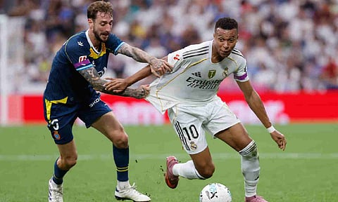 Goalscorer Kylian Mbappe (R) dribbles past defender Fernando Calero