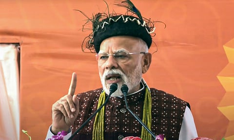Prime Minister Narendra Modi addresses the gathering during the foundation stone laying and inauguration of various development projects, in Itanagar, Arunachal Pradesh (PTI)