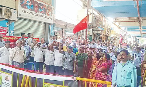 Traders from Wimco Nagar and Tiruvottiyur areas standing in solidarity with the MRF workers on Wednesday