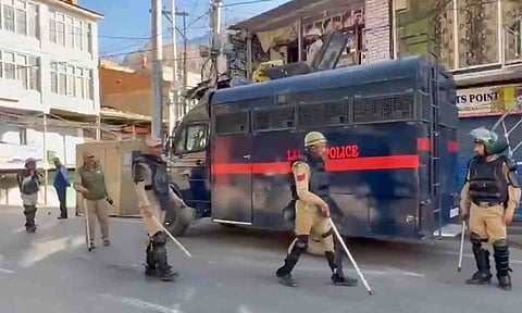 Police personnel stand guard a day after violence erupted over statehood and other demands, in Leh, Ladakh, Thursday, Sept. 25, 2025 (PTI) 
