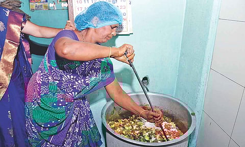 A worker at a mid-day meal centre (file photo)