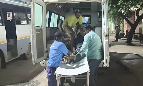 Bodies of the workers being brough to Stanley Hospital.
