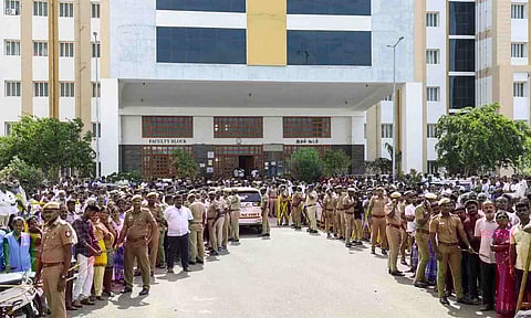 Police personnel and others at the Government Hospital, where injured persons of a stampede that occurred at actor and TVK chief Vijay's rally on Saturday, in Karur district, Tamil Nadu, Sunday, Sept. 28, 2025 (PTI) 