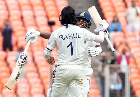  India's KL Rahul celebrates his century with Dhruv Jurel during the second day of the first Test cricket match between India and West Indies at the Narendra Modi Stadium in Ahmedabad, Gujarat, Friday, Oct. 3, 2025 (PTI) 