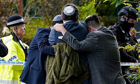 One of two victims in Manchester synagogue attack may have been killed by bullet fired by police (AP)