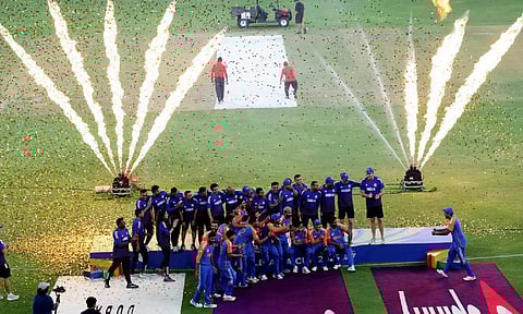 Indian players and team staff celebrate after winning the Asia Cup 2025, at Dubai International Cricket Stadium in Dubai. | Photo Credit: Reuters