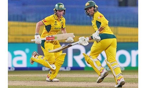 Australia's Beth Mooney, left, and Alana King run between the wickets to score during the ICC Women's Cricket World Cup match between Australia and Pakistan at Premadasa Stadium in Colombo, Sri Lanka, Wednesday, Oct, 8, 2025 (PTI) 