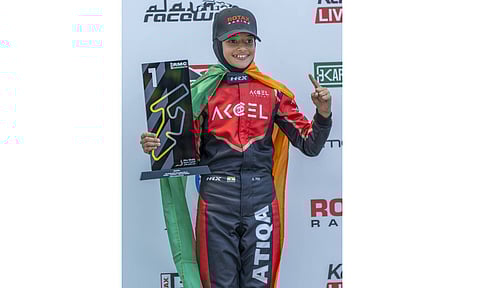 Indian racer Atiqa Mir, 10, celebrates victory in round one of RMC Invitational Karting Series, at Al Ain Raceway, in United Arab Emirates, Sunday, Oct. 12, 2025 (PTI) 