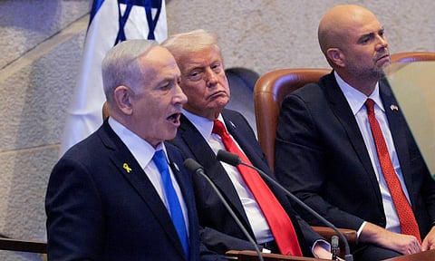 Israeli Prime Minister Benjamin Netanyahu addresses the Knesset as President Donald Trump and Amir Ohana, Speaker of the Israeli Knesset listen, Monday, Oct. 13, 2025 in Jerusalem (AP) 