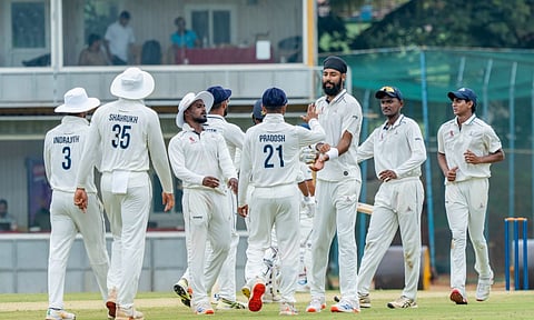 Gurjapneet Singh celebrates after taking a wicket