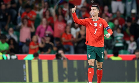Cristiano Ronaldo celebrates after becoming all-time leading scorer in World Cup qualifying