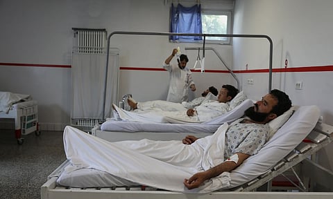 Wounded men from Wednesday's two drone strikes receive treatment at the Emergency Hospital, in Kabul, Afghanistan.(Photo: AP)